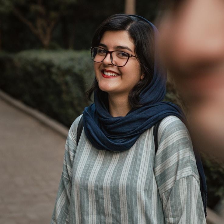 Kaveri Mehta, Lead Design Curator at ForumLuminexCore, reviewing corporate floral arrangements